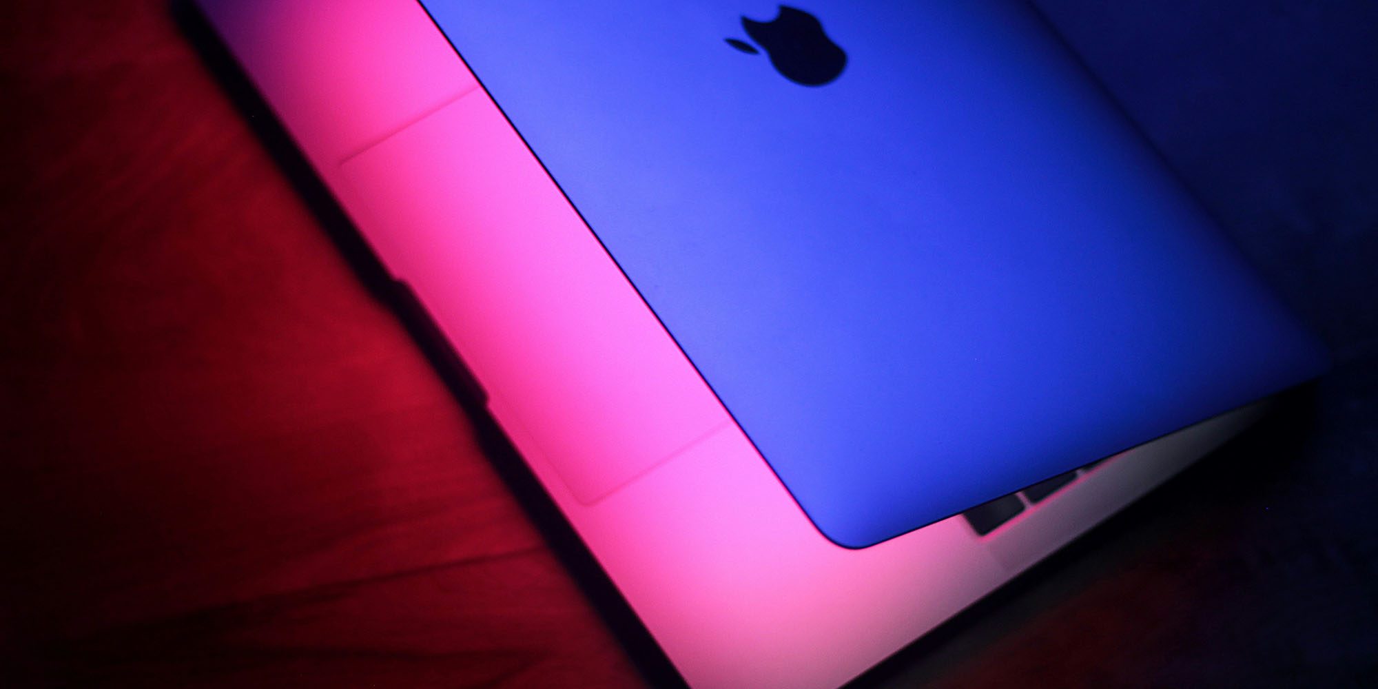 A serious Mac screen sharing vulnerability is being actively exploited | Image shows a partially open MacBook with the screen on